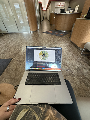 Picture of laptop using the Adobe After Affect program, in an Urgent Care waiting room